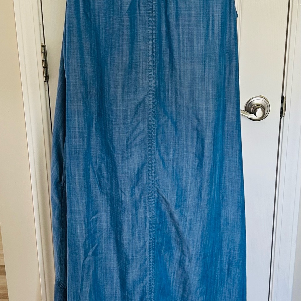Blue chambray dress Crown & Ivy sleeveless. Has fringe around bottom.  High/low